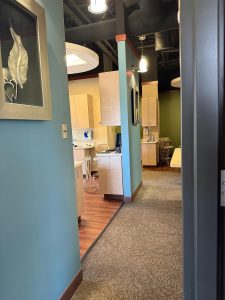 Hallway with a view into treatment rooms